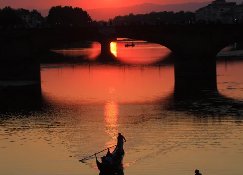 silhouette-person-boat-against-sky-sunset
